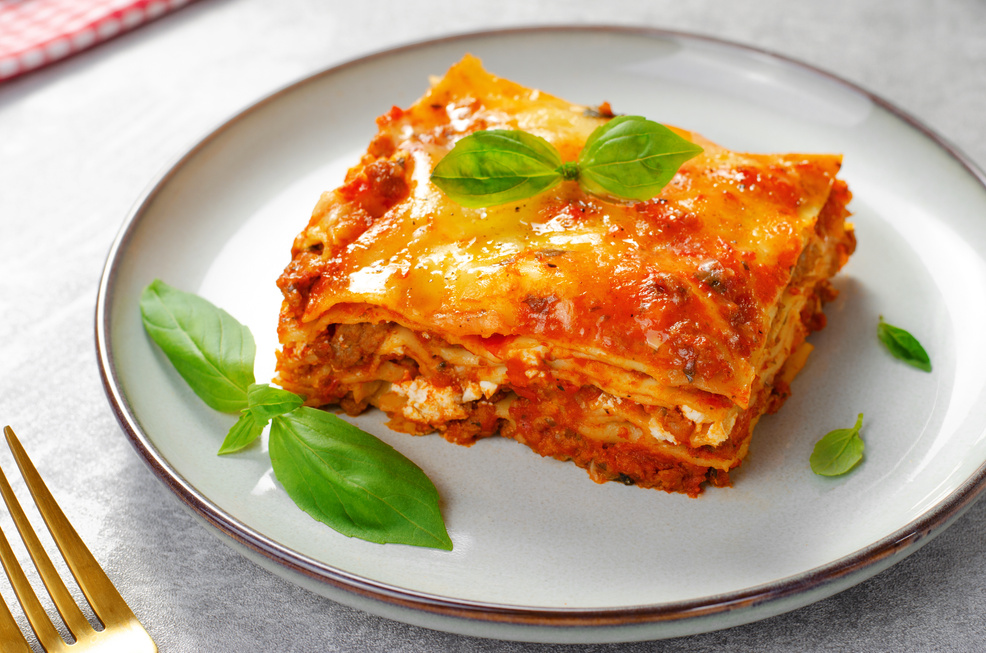 Delicious Homemade Lasagna with Bolognese Sauce on Bright Background, Italian Cuisine, Tasty Baked Lasagna